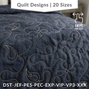 May include: A navy blue quilt with a cream-coloured, embroidered floral design. The quilt features the text "Quilt Designs | 20 Sizes" and "SWIPE FOR SIZES". The bottom of the quilt has the text "DST-JEF-PES-PEC-EXP-VIP-VP3-XXX".