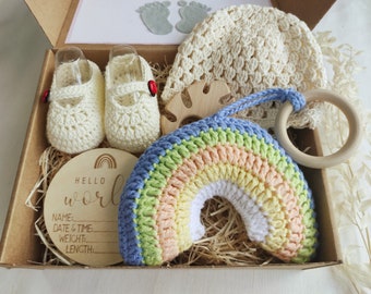 Announcement pregnancy gift to grandparents with beanie booties and rainbow plush, New parents gift basket idea with baby shoes, hat and toy