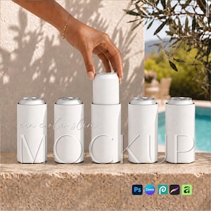 May include: Five white slim can coolers arranged in a row on a stone surface. One cooler is being topped with a white beverage can. The text can cooler slim MOCKUP is visible across the front of the items in a light script and bold font.