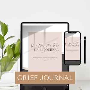 May include: A digital mockup of a grief journal on a tablet and phone. The journal cover is pink with the text "One Day At a Time GRIEF JOURNAL" and the subtitle "Embracing the Journey: A Guided Grief Journal for Navigating Loss One Day at a Time".