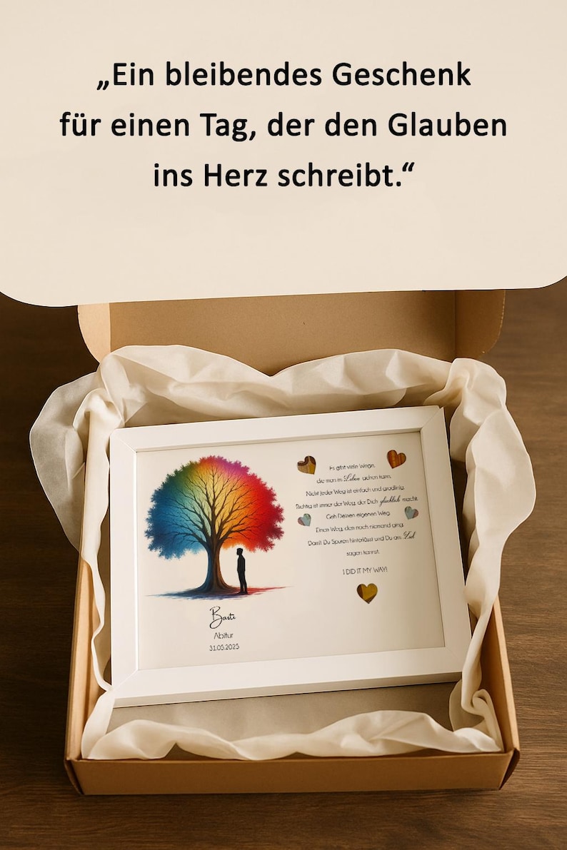 May include: A white framed print with a rainbow tree and a quote in German. The quote reads "Ein bleibendes Geschenk f&uuml;r einen Tag, der den Glauben ins Herz schreibt." The print also includes the text "Bat Abitur 31.05.2025".