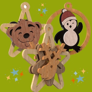 May include: Three wooden Christmas ornaments, each with a different design. The first ornament is a star with a brown bear face. The second ornament is a star with a reindeer face. The third ornament is a circle with a penguin inside.