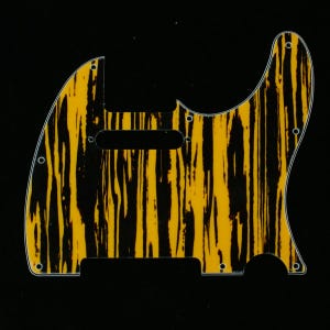 May include: A guitar pickguard featuring a yellow and black tiger stripe design. The pickguard has pre-drilled holes for mounting and cutouts for the guitar's pickups and controls. The shape is designed for a specific guitar model.