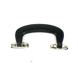 May include: Black leather handle with silver metal clasps. The handle is designed for attaching to a suitcase or bag.