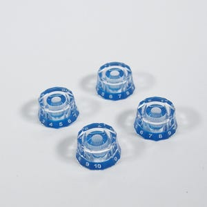 May include: Four clear blue plastic knobs with white numbers. The numbers on the knobs are 3, 4, 5, 6, 7, 8, 9, and 10.
