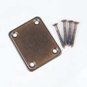 May include: A square, copper-colored metal plate with four screw holes and a black border. Four copper-colored screws are included.