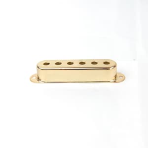 Puede incluir: Tapa de pastilla de guitarra de metal dorado con seis agujeros.