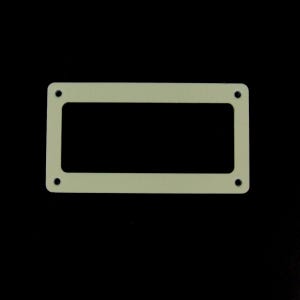 May include: A cream-colored plastic rectangular frame with four black screw holes.