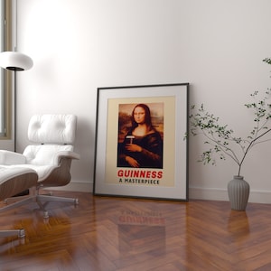 May include: A framed print of the Mona Lisa holding a glass of Guinness beer. The print has the text "GUINNESS A MASTERPIECE" at the bottom.