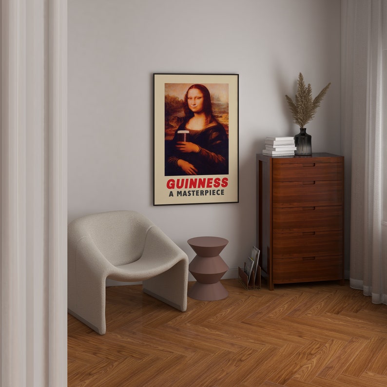 May include: A framed poster with a humorous image of the Mona Lisa holding a pint of Guinness. The poster has the text "GUINNESS A MASTERPIECE" at the bottom.