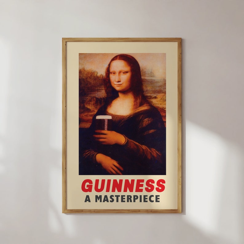 May include: A vintage-style poster featuring a painting of the Mona Lisa holding a glass of Guinness. The text "GUINNESS A MASTERPIECE" is printed in red at the bottom of the poster.