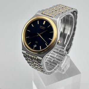 Vintage Seiko SQ Two tone Stainless Steel 36mm Men’s Quartz Watch c. May 1991