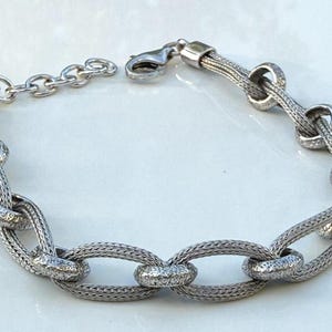 Handgemaakte sterlingzilveren verweven schakelarmband: elegante zilveren sieraden