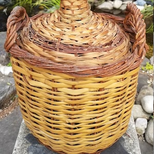 Vintage V. Levante Spanish wicker covered green glass demijohn bottle.  19 inches tall x 15 inches wide circa 1950&#39;s