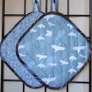 Swans Flying High Potholders: white blue clouds birds sky quilted insulated machine-washable machine-dryable homemade