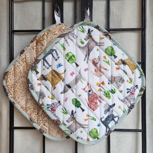 Dog Park Potholders: tulips bugs handmade quilted insulated machine-washable machine-dryable white brown green gray