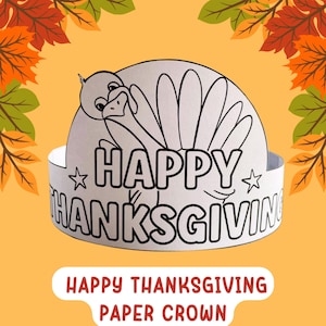 May include: A white paper crown with a turkey design and the words "HAPPY THANKSGIVING" in black. The crown is decorated with stars and is set against a yellow background with fall leaves.