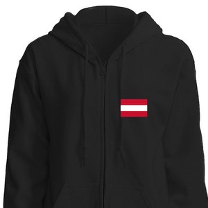 May include: A black zippered hoodie with a small red and white flag on the left chest. The flag is the national flag of Latvia.