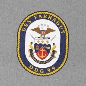 May include: A grey patch with a navy blue and gold circular emblem. The emblem features a white eagle with a red shield and anchor. The text "USS FARRAGUT DDG 99" is written around the emblem. The text "PREPARED FOR BATTLE" is written below the emblem.