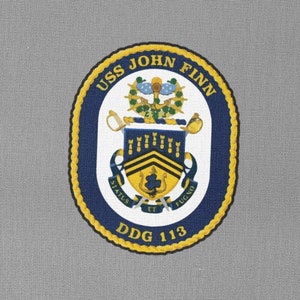 May include: A navy blue and gold embroidered patch with the text "USS JOHN FINN DDG 113".