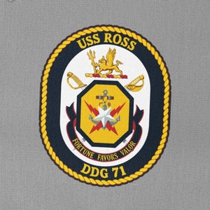 May include: A navy blue and gold patch with the text "USS ROSS" and "DDG 71". The patch features a central emblem with a trident, lion, swords, and the words "FORTUNE FAVORS VALOR".