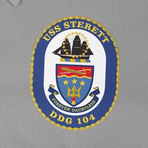 May include: A blue and gold embroidered patch with the text "USS STERETT DDG 104" and a ship's crest with the words "Forever Dauntless".