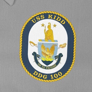May include: A blue and gold embroidered patch with the text "USS KIDD DDG 100" and a crest featuring a winged figure holding a sword.