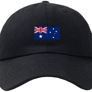May include: A black baseball cap with an embroidered Australian flag on the front. The flag is blue, red, and white with a white star in the centre and a constellation of stars in the top right corner.