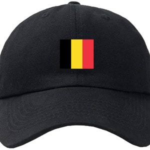 May include: A black baseball cap with the Belgian flag embroidered on the front.