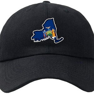May include: A black baseball cap with an embroidered image of the state of New York, featuring the state flag and the text "NEW YORK" on the front.