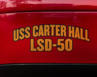 May include: A red car with a gold sticker that reads "USS CARTER HALL LSD-50".