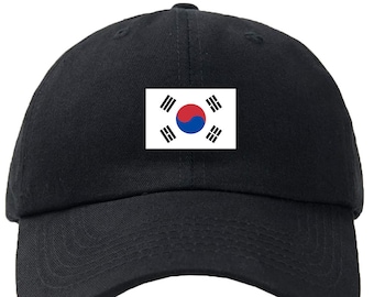 May include: A black baseball cap with the South Korean flag embroidered on the front.