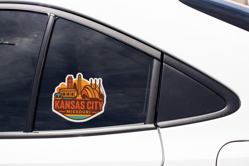 A sticker on the side of a car window that says "KANSAS CITY MISSOURI".