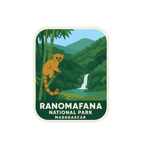 May include: A rectangular sticker featuring a cartoon illustration of a lemur in a forest setting. The lemur is orange with a striped tail, perched on bamboo stalks. The background shows a waterfall, mountains, and the text "RANOMAFANA NATIONAL PARK MADAGASCAR."