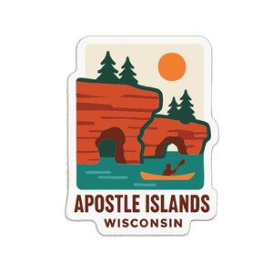 May include: A sticker featuring a scenic illustration of the Apostle Islands in Wisconsin. The design includes red rock formations, green trees, a kayak on blue water, and a setting sun. The text "Apostle Islands Wisconsin" is at the bottom.