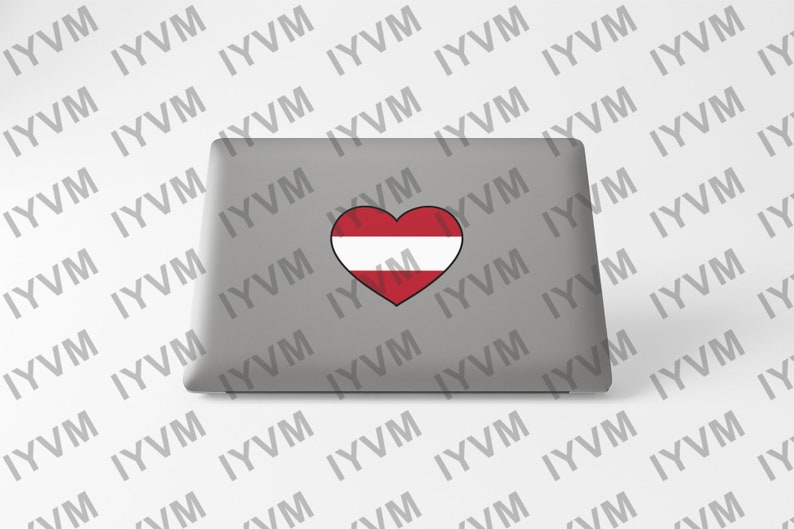 May include: A gray laptop computer with a heart-shaped sticker featuring the Austrian flag. The flag is red, white, and red with a white outline.