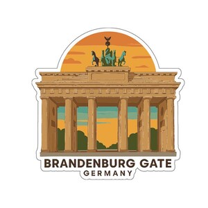 May include: A sticker featuring the Brandenburg Gate in Berlin, Germany. The illustration shows the iconic landmark in shades of tan and brown, with a sunset-colored sky in the background. The text "BRANDENBURG GATE GERMANY" is at the bottom.