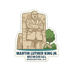 May include: A sticker featuring a cartoon illustration of the Martin Luther King Jr. Memorial in Washington, D.C. The image shows a statue of Martin Luther King Jr. in a suit, with the text "MARTIN LUTHER KING JR. MEMORIAL WASHINGTON, D.C."