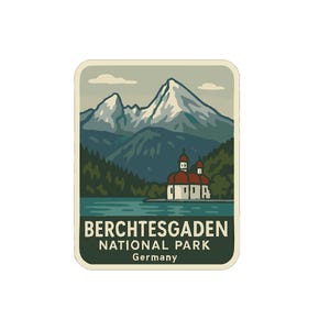 May include: A rectangular sticker featuring a scenic illustration of Berchtesgaden National Park in Germany. The design includes snow-capped mountains, a lake, evergreen trees, and a church with a red roof. The text "BERCHTESGADEN NATIONAL PARK Germany" is at the bottom.