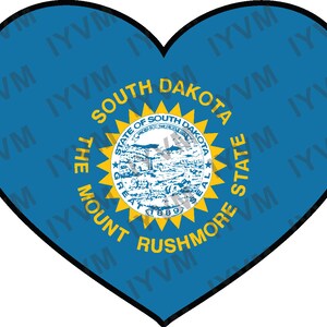 May include: A blue heart-shaped flag with a yellow sunburst and the state seal of South Dakota. The seal depicts a scene of Mount Rushmore with the words "The Mount Rushmore State" and "State of South Dakota" surrounding it.