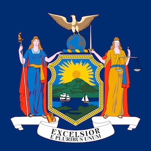 May include: The official flag of New York State features a blue background with the state seal in the center. The seal depicts a shield with a sun rising over a mountain range and a river with ships sailing on it. The shield is flanked by two figures, one holding a staff with a liberty cap and the other holding a scale of justice. The motto "Excelsior" and "E Pluribus Unum" are inscribed on a ribbon below the shield.
