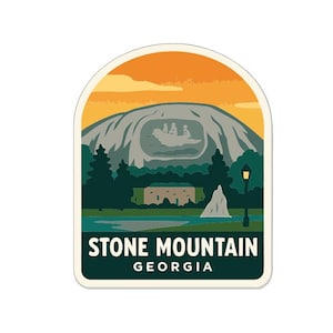 May include: A sticker featuring Stone Mountain, Georgia, with a scenic landscape. The design includes a mountain, trees, a lake, and a building, all under an orange and yellow sky. The text "STONE MOUNTAIN GEORGIA" is at the bottom.