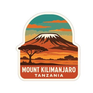 May include: A sticker depicting Mount Kilimanjaro in Tanzania. The design shows a mountain with a snow-covered peak, a tree, and a sunset in orange, brown, and teal hues. The text "MOUNT KILIMANJARO TANZANIA" is in white.