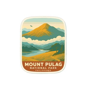 May include: A sticker featuring a stylized landscape of Mount Pulag National Park in the Philippines. The design includes a golden mountain, teal hills, a river, and the text "Mount Pulag National Park Philippines."