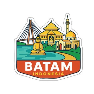 May include: A sticker featuring a colourful illustration of Batam, Indonesia. The design includes a bridge, a seated Buddha statue, a mosque, and other buildings. The text "BATAM INDONESIA" is displayed in a red and white banner.