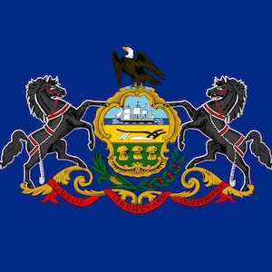 May include: The state seal of Pennsylvania features a blue background with a gold shield in the center. The shield depicts a ship sailing on a blue body of water with a green field below. Two black horses stand on either side of the shield, facing outward. The shield is surrounded by a gold wreath with green leaves and red berries. A red ribbon with the words "VIRTUE, LIBERTY AND INDEPENDENCE" is wrapped around the wreath.