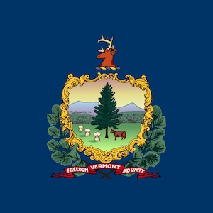 May include: The state flag of Vermont features a blue background with a gold-framed coat of arms in the centre. The coat of arms depicts a green pine tree, a cow, and three white mushrooms on a green field. Above the coat of arms is a gold-coloured deer with antlers. Below the coat of arms is a red ribbon with the words "FREEDOM AND UNITY" and "VERMONT" in gold lettering.