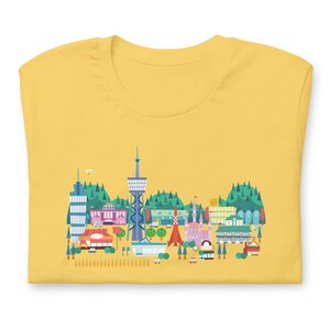 Camisa Machi Koro Jogo de Cartas Inspirado Unissex Soft Bella + Camiseta de Lona Presente para Jogadores de Tabuleiro Arte Não Oficial de Fãs
