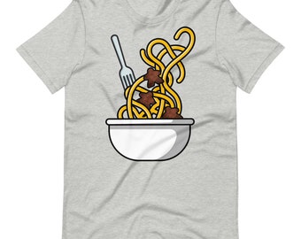 May include: A white bowl with a fork sticking out of it, filled with yellow spaghetti and brown meatballs.