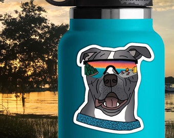 May include: A sticker of a gray pit bull wearing sunglasses with a sunset and camping scene reflected in the lenses. The sticker is on a blue water bottle with the text "Life Outside Sticker Company" on the top. The sticker is 2.5 inches by 2 inches.